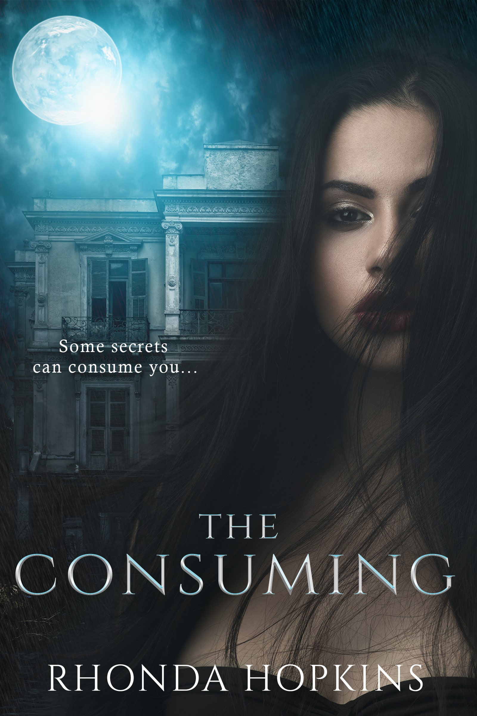The Consuming by Rhonda Hopkins. A young woman with brown hair blowing in her ace stands in front of a large home. Atmosphere is eerie.