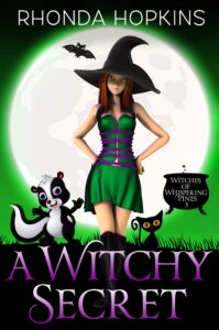 A Witchy Secret by Rhonda Hopkins. There's a teen girl in a cute green dress, black boots, and a witch's hat standing in front of a large moon on a green background. A cute black kitten on her left and an adorable skunk on her right. A cauldron sits to the right.